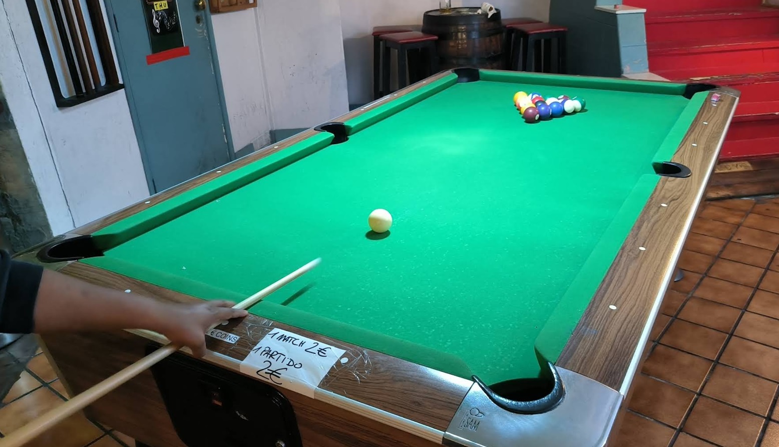 Inside Paddy's Anchor sports bar with screens and bar seating